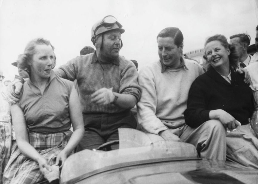 Jaguar's C-types are a force to be reckoned with at the Le Mans 24-hour endurance race. Major Tony Rolt (left) and Duncan Hamilton (right) celebrate with their wives after winning the title in 1953.