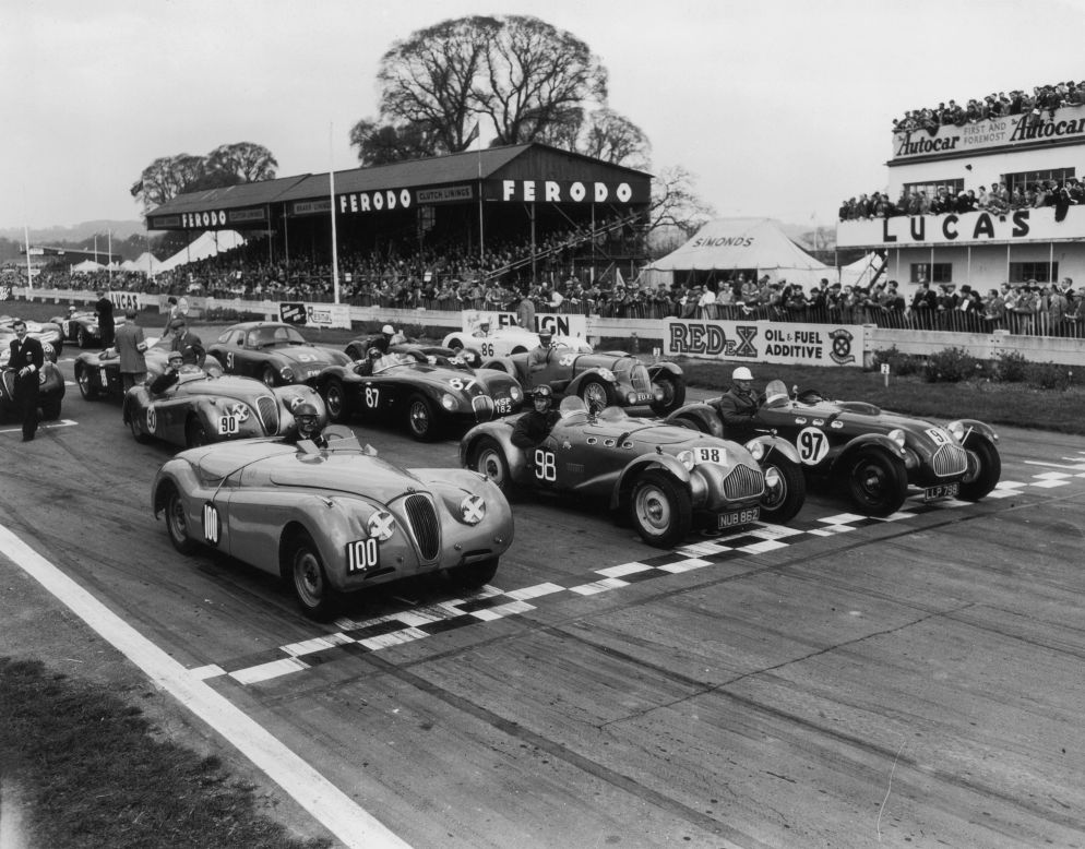 The Jaguar XK 120 (No. 100) seen here at the start of the first Easter Handicap race at Goodwood in 1954. The two-seater sports car was in production from 1948-54. 