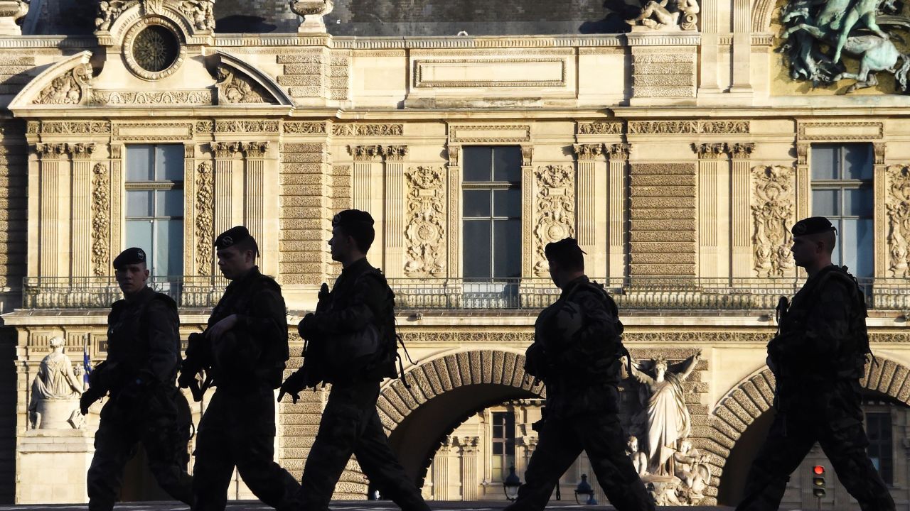 French soldiers patrol next to the Louvre in Paris on December 23, 2015 as part of security measures set following the November 13 Paris terror attacks. / AFP / DOMINIQUE FAGET        (Photo credit should read DOMINIQUE FAGET/AFP/Getty Images)