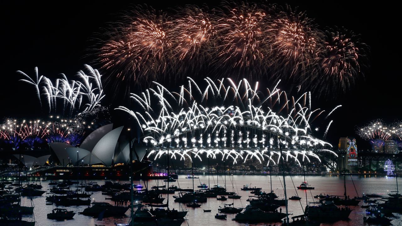 Fireworks shoot off the harbor bridge in Sydney.