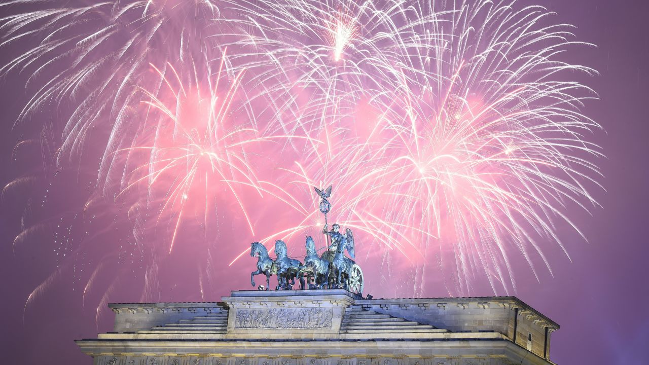 Fireworks explode at Berlin's Brandenburg Gate to usher in 2016.