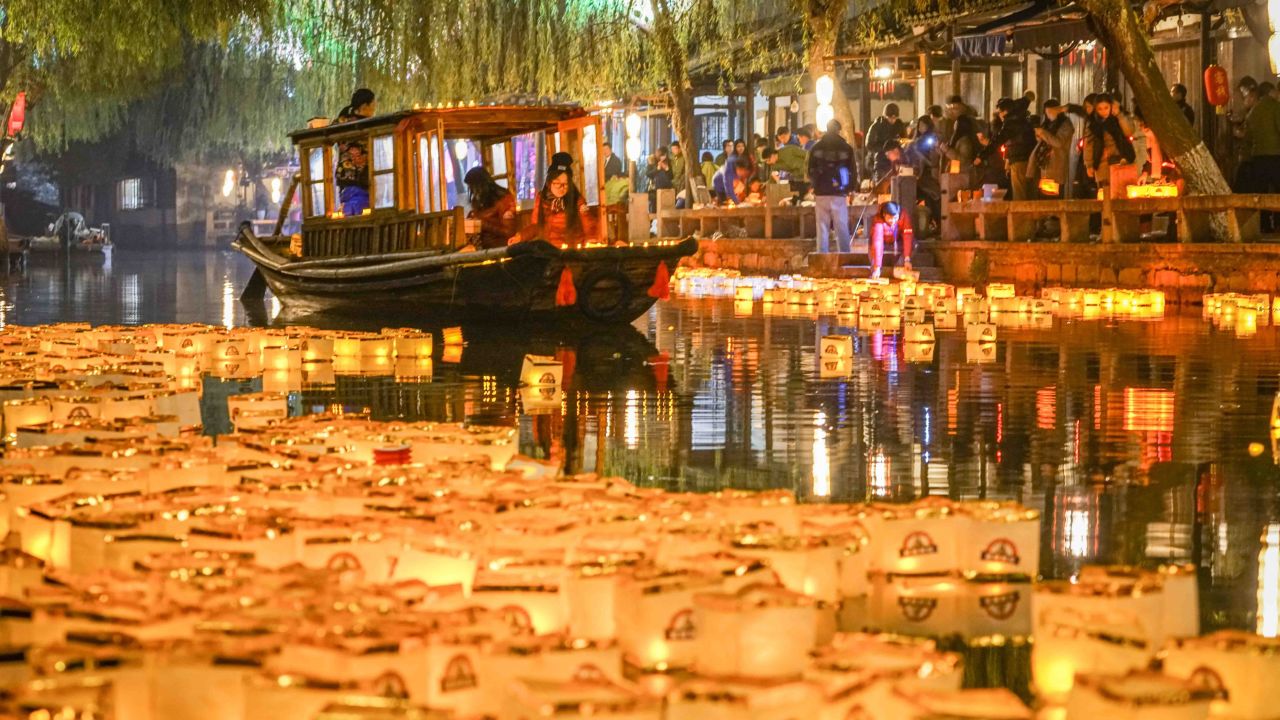 Lanterns float on a river in Zhouzhuang, China.