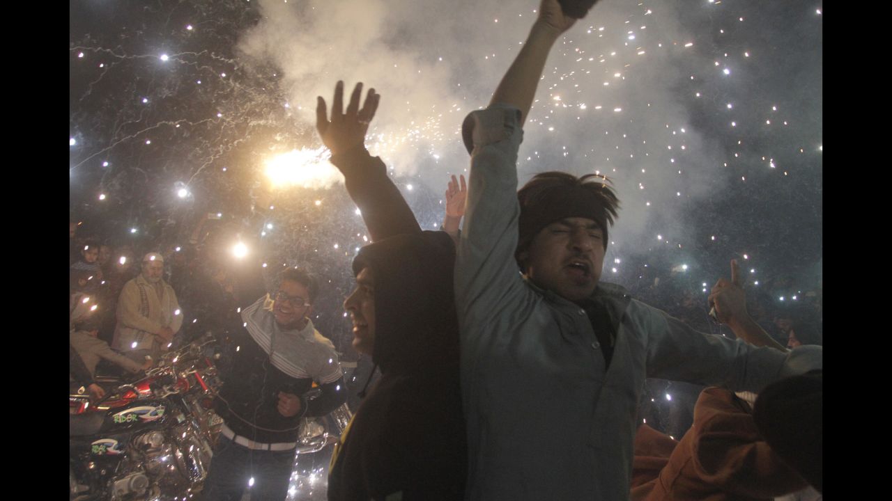 Pakistani youths celebrate the New Year in Lahore, Pakistan.
