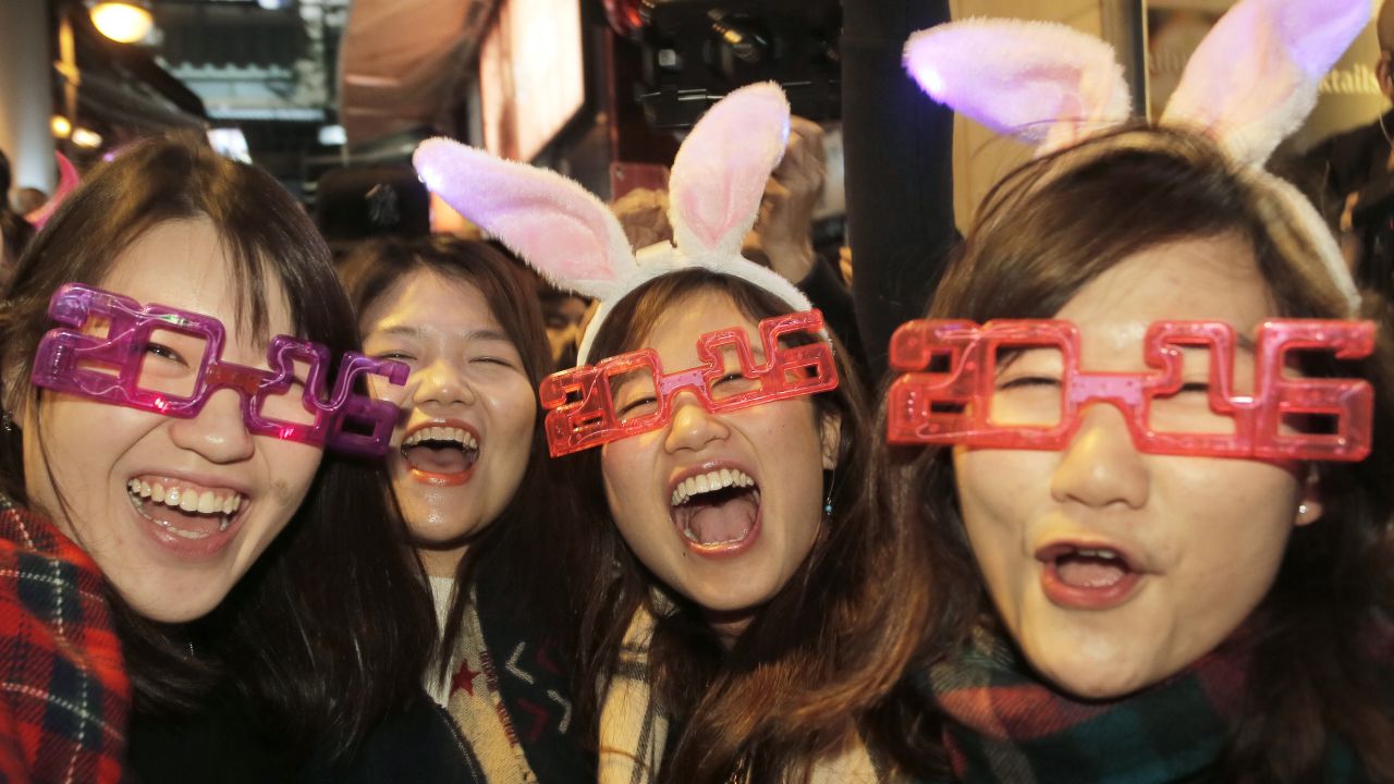 Revelers smile during the New Year's Eve celebrations in Hong Kong.