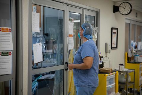 A health care worker prepares to enter a Covid-19 patient's room in the ICU at Van Wert County Hospital in Van Wert, Ohio on Nov. 20.