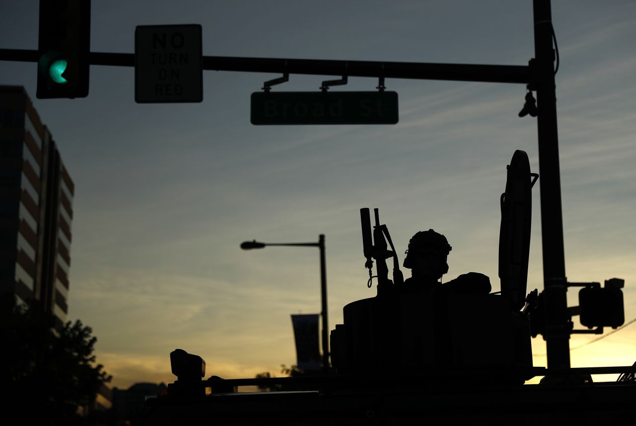 A Philadelphia Police Department SWAT team member sits in a vehicle in downtown Philadelphia during enforcement of a curfew, on Monday, June 1. 