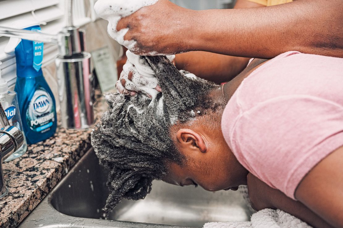 Many Black families use their kitchens for wash day. "Easy access to a sink, space to place multiple supplies and products, in addition to the ability to interact with the rest of the family, watch television and eat a snack," Faxio explains in her book, "makes the location convenient and comfortable."