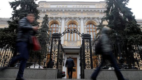 People walk past the Central Bank headquarters in Moscow in this 2019 file photo. 