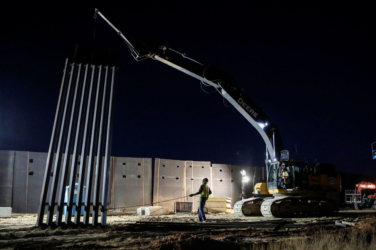 U.S. workers build the new 13-mile border wall construction project in the desert between Sunlad Park, New Mexico, and Ciudad Juarez, Mexico, on January 15. 