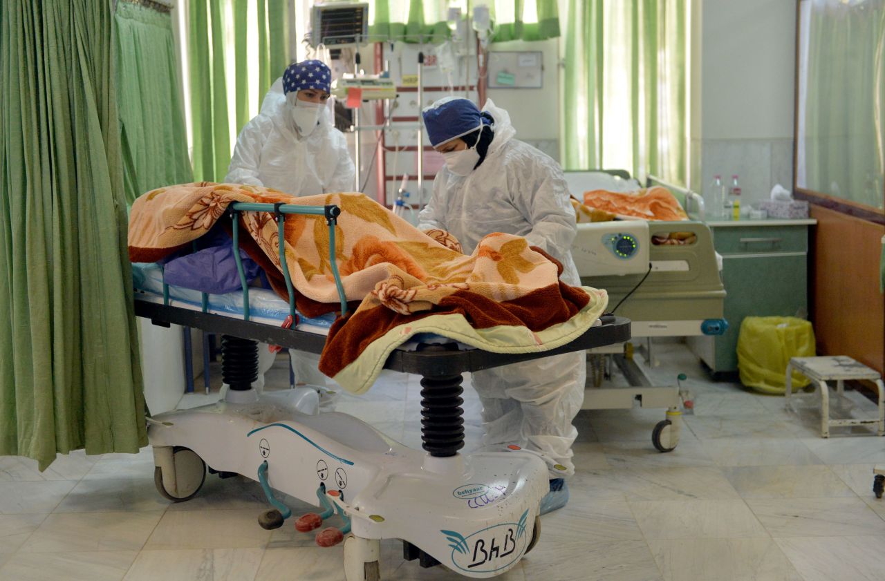 Health care staff take care of Covid-19 patients in an intensive care unit in Tehran in December.