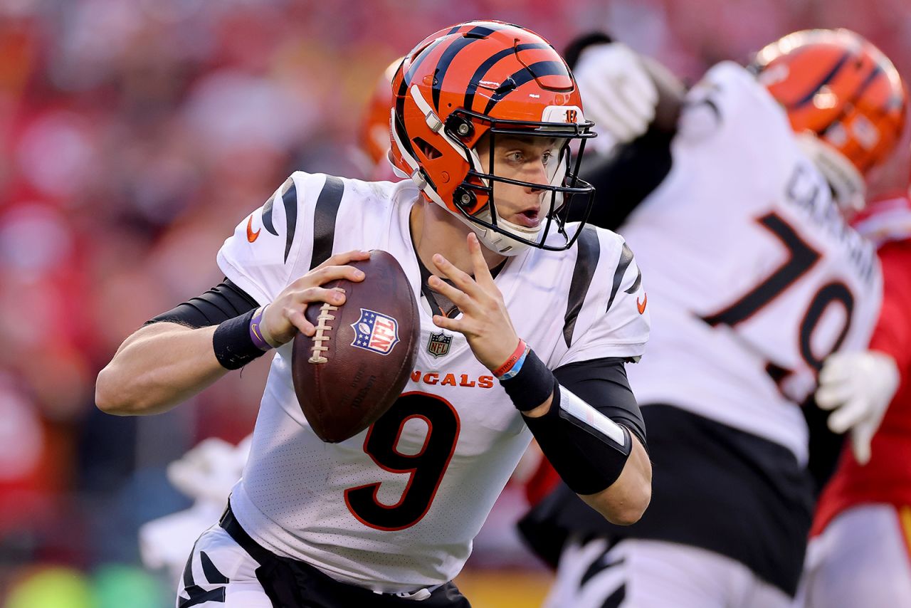 Quarterback Joe Burrow of the Cincinnati Bengals rolls out to pass against the Kansas City Chiefs during the second half of the AFC Championship Game at Arrowhead Stadium on January 30, in Kansas City, Missouri.