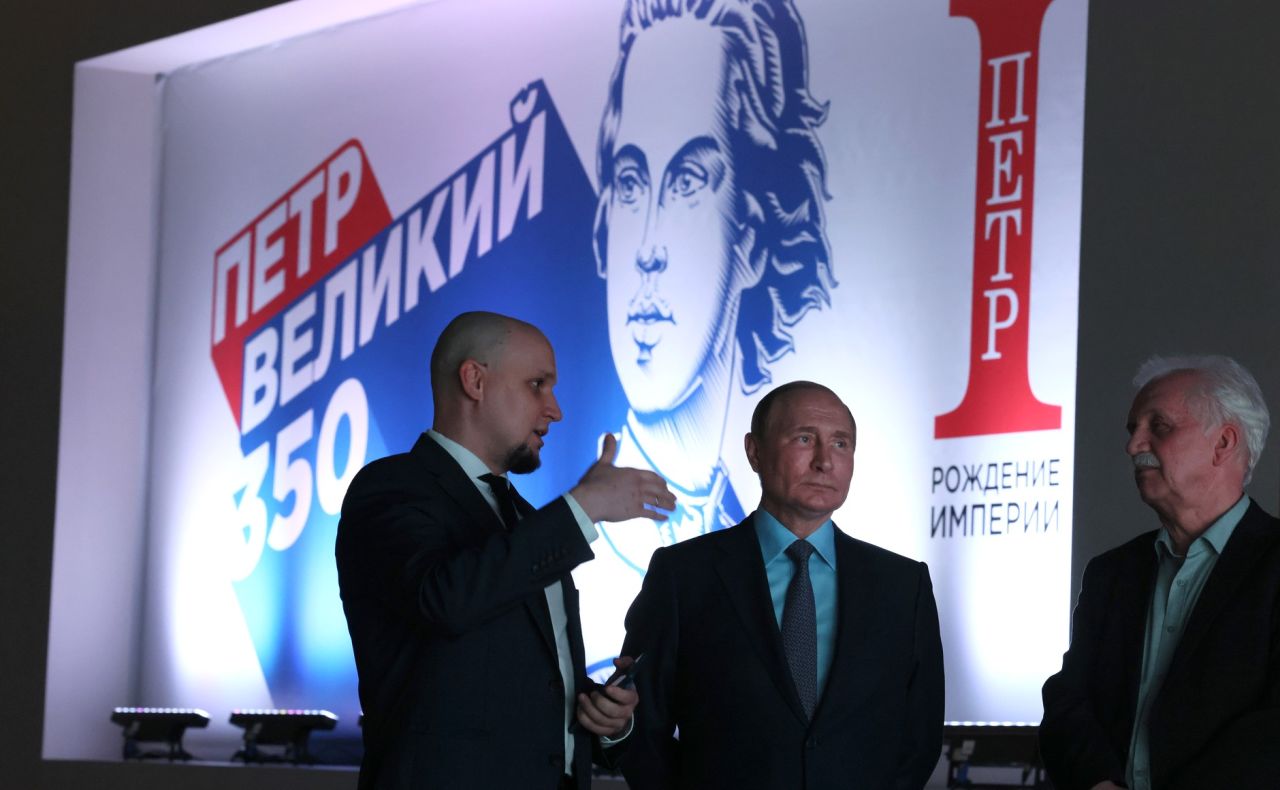 Russian President Vladimir Putin tours the?Peter the?Great: Birth of?the?Empire multimedia exhibition in?the?Russia?– My?History historic park at?VDNKh on June 9. Ivan Yesin, chair of?the?Russia?– My?History Association of?Historic Parks, left, and?Alexander Myasnikov, chief editor of?the?project, explain the?exhibits.