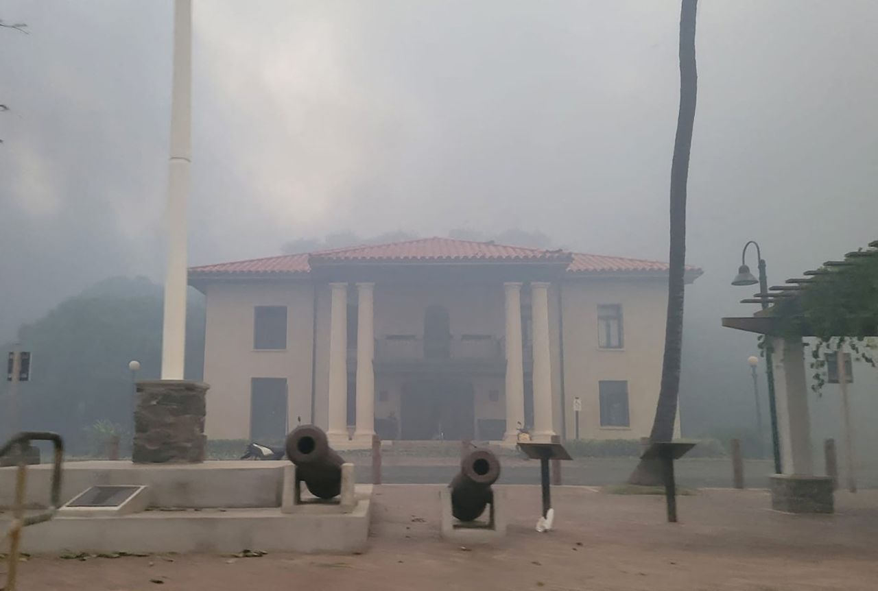 Smoke obscures the old Lahaina courthouse as wildfires driven by high winds destroy a large part of the historic town of Lahaina, Hawaii, on August 9, 2023.