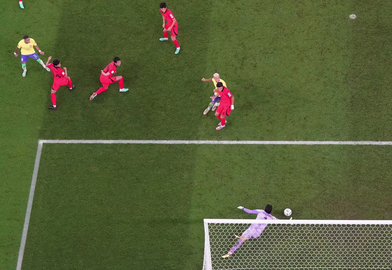Kim Seung-gyu makes a save from Brazil's Raphinha.