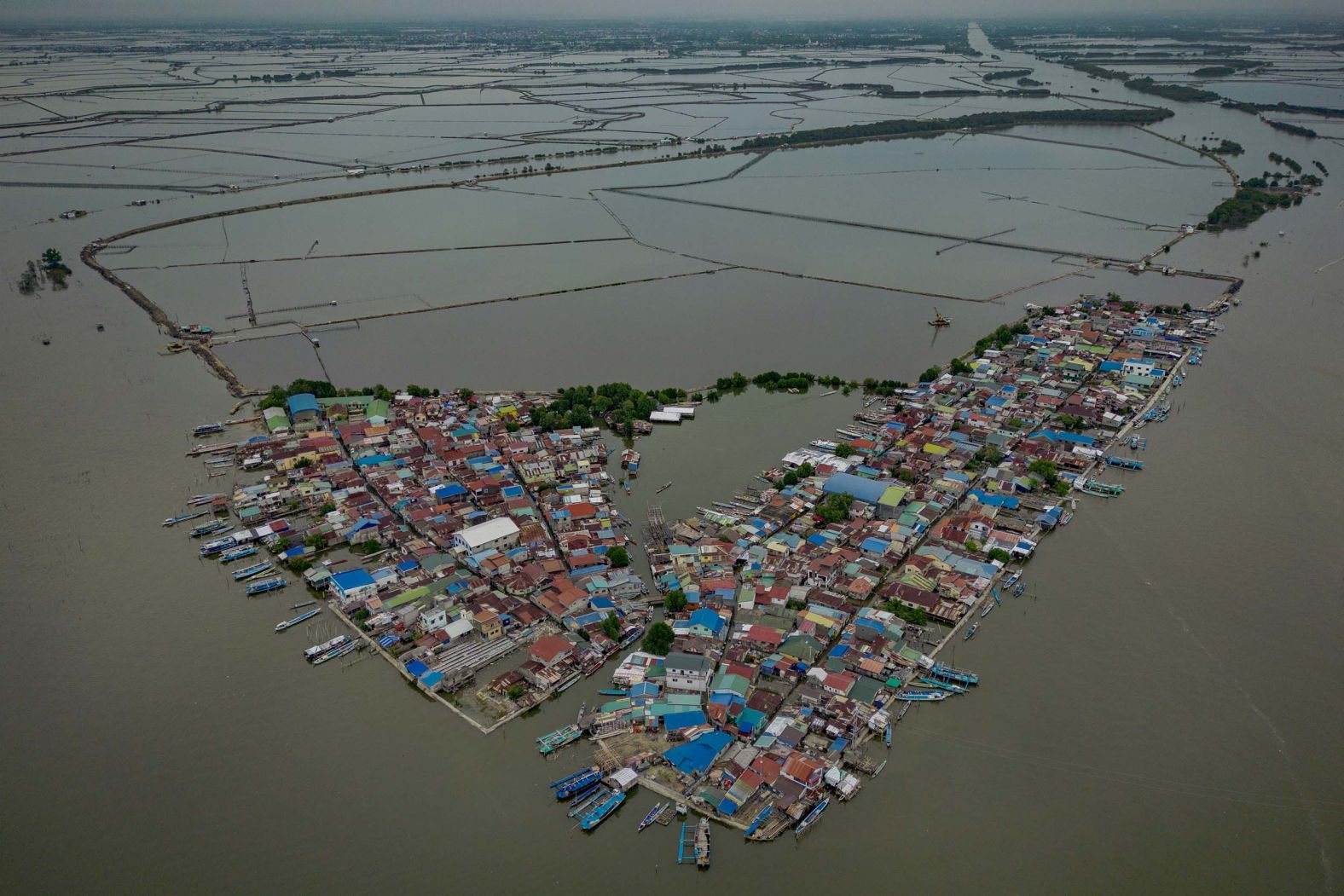An aerial photo show Tibaguin Island in Hagonoy, Philippines, partially submerged by seawater amid rising tides on Saturday, August 9.