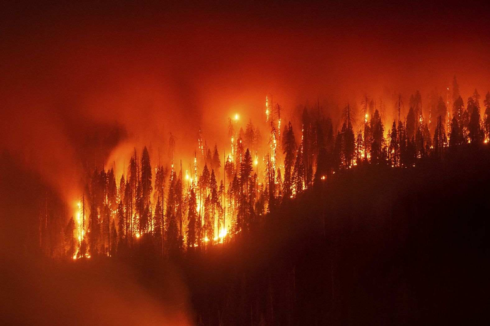 This long-exposure photograph shows the Garnet Fire burning in California’s Sierra National Forest on Monday, September 8. <a href="index.php?page=&url=https%3A%2F%2Fwww.cnn.com%2F2025%2F09%2F09%2Fweather%2Fcalifornia-sequoias-burning-sierra-national-forest-hnk">The wildfire</a> was sparked by lightning.