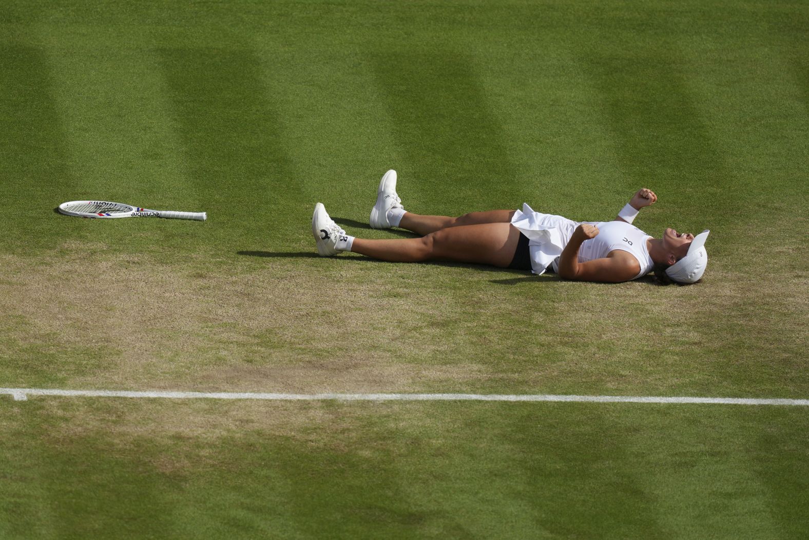 Iga Świątek celebrates after <a href="index.php?page=&url=https%3A%2F%2Fwww.cnn.com%2Fsport%2Flive-news%2Fwimbledon-final-womens-25-07-12-spt">winning the Wimbledon final</a> on Saturday, July 12. Świątek defeated Amanda Anisimova 6-0, 6-0. That scoreline hasn’t happened in a women’s Wimbledon singles final since 1911.