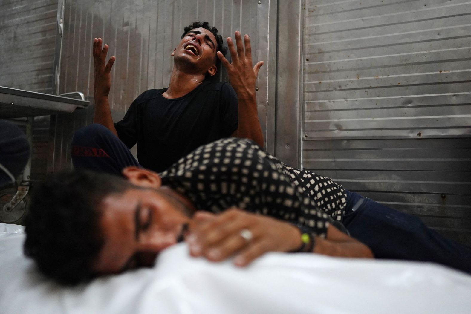 Palestinians mourn over the body of a relative killed in an Israeli strike, ahead of their funeral in Khan Younis, Gaza, on Monday, August 12. <a >More than 40,000 Palestinians have been killed in Gaza</a> since Israel launched its?offensive in the Palestinian enclave following Hamas’ October 7 attack, the local health ministry said Thursday.