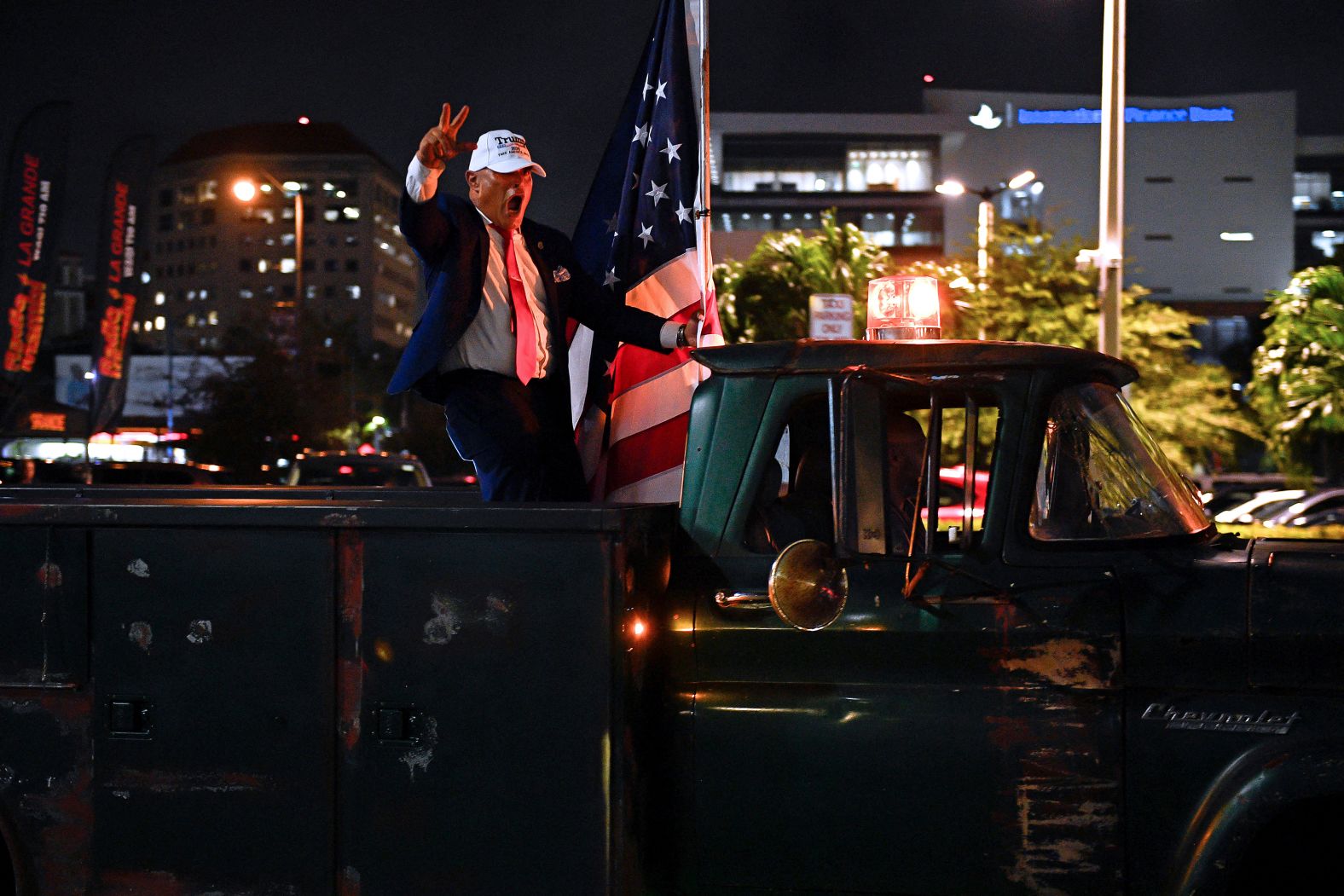 A supporter of former President Donald Trump gestures from a truck outside of the Versailles restaurant in Miami on Tuesday, November 5.