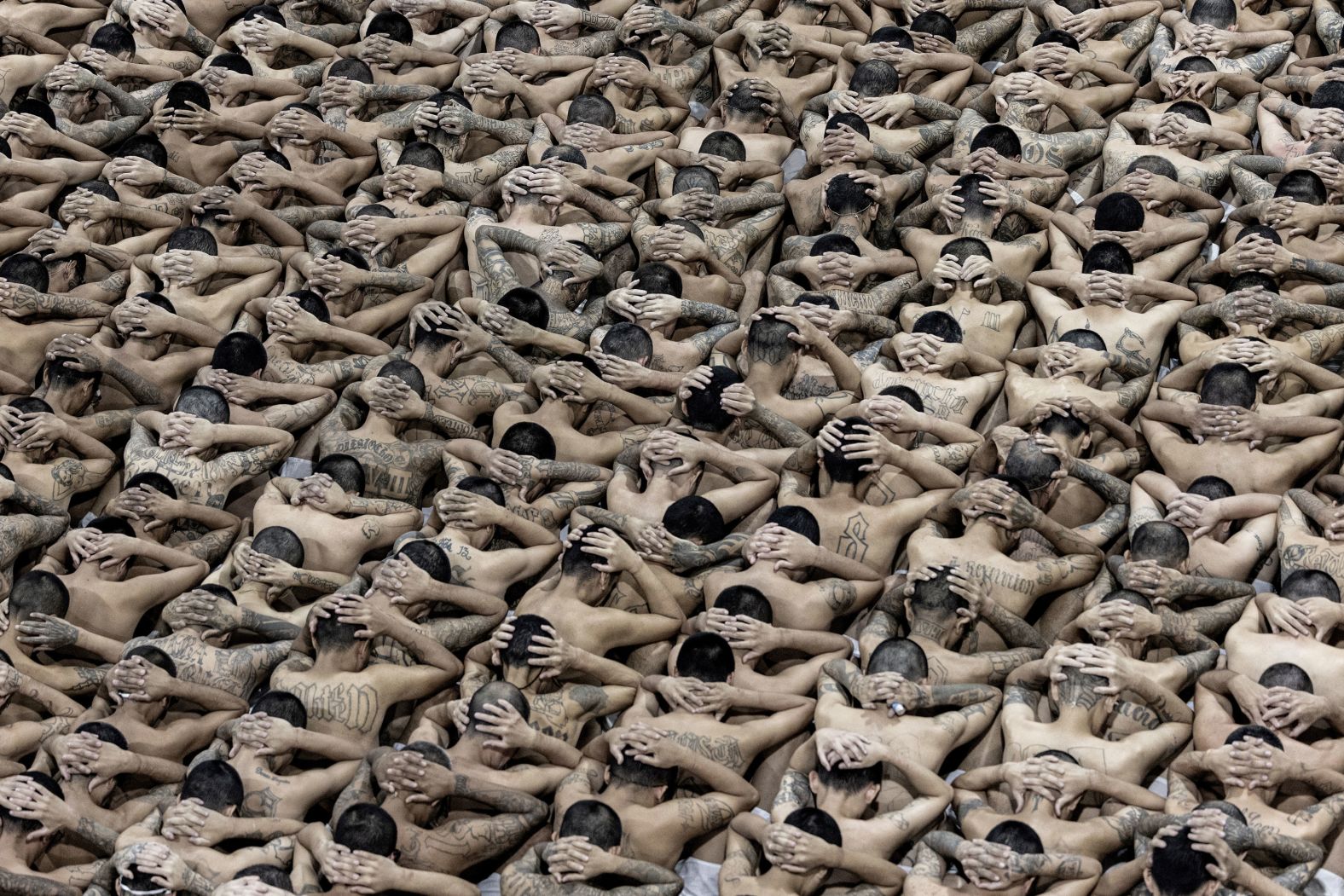 Suspected gang members wait to walk in their cells after they were transferred to the Terrorism Confinement Center in Tecoluca, El Salvador, on Tuesday, June 11.