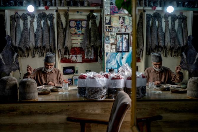 Saleem Arghandiwal makes Karakul hats at his embroidery shop in Kabul, Afghanistan, on Tuesday, May 27. The hats are crafted from the fur of Karakul sheep.
