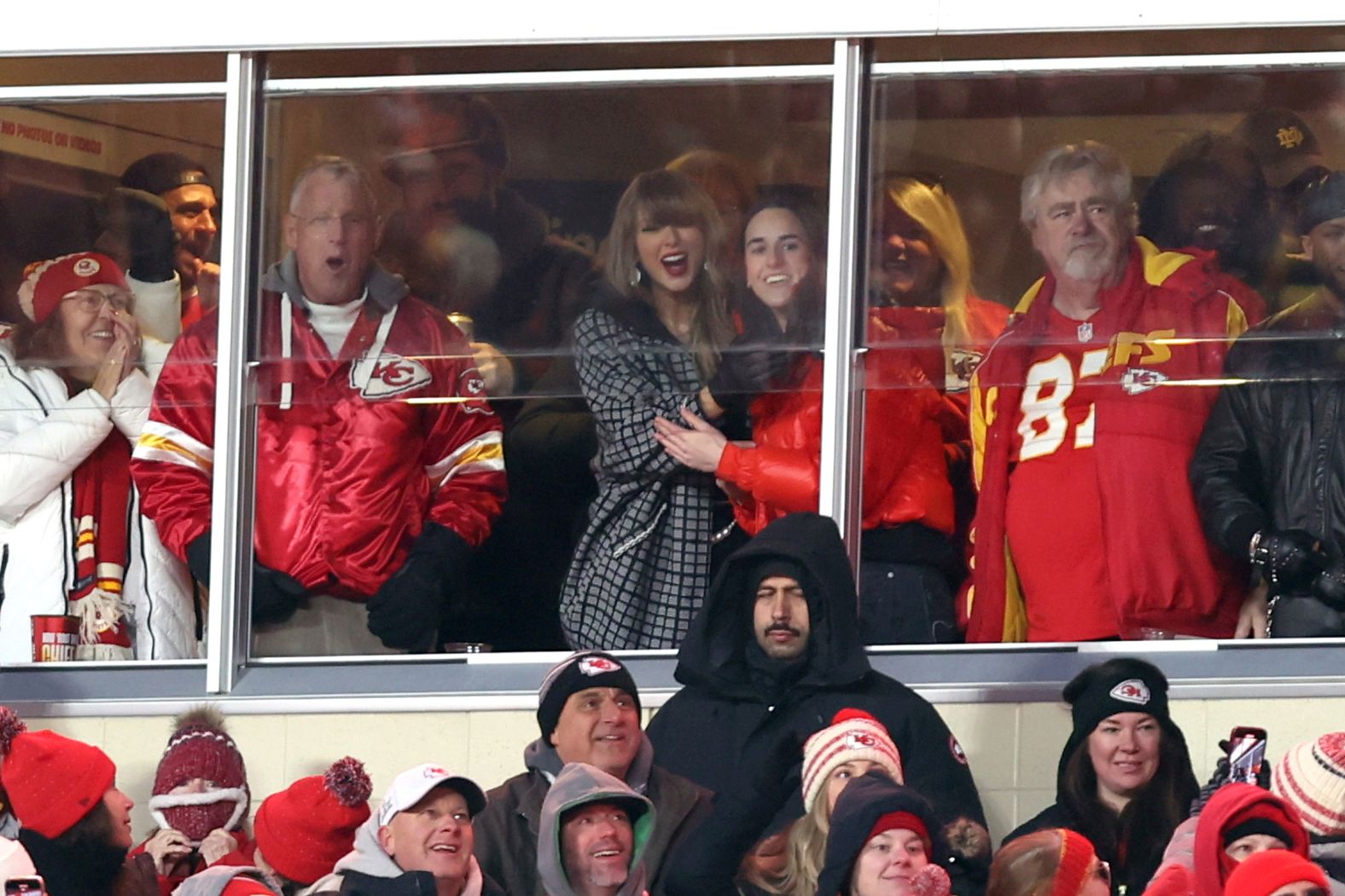 Singer Taylor Swift and basketball star Caitlin Clark, center, celebrate while watching a Kansas City Chiefs playoff game on Saturday, January 18. Swift is dating Chiefs star Travis Kelce. Clark has been a <a href="index.php?page=&url=https%3A%2F%2Fwww.cnn.com%2F2025%2F01%2F03%2Fsport%2Fcaitlin-clark-wnba-chiefs-taylor-swift-kelce-spt%2Findex.html">lifelong Chiefs fan</a>.