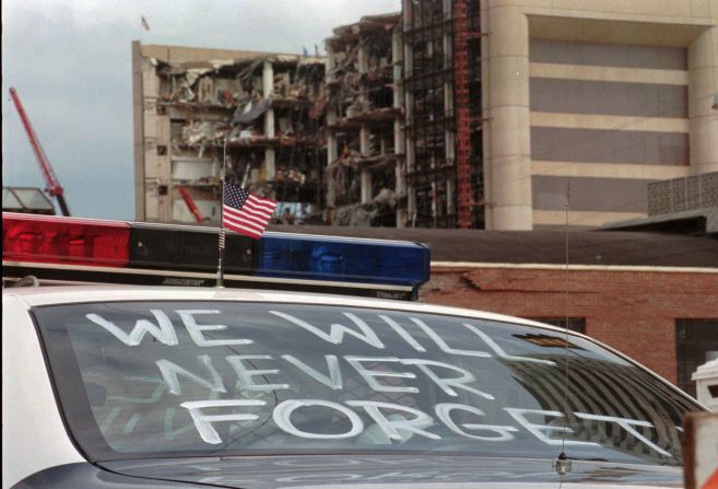An Oklahoma City police car is decorated with the words "we will never forget."