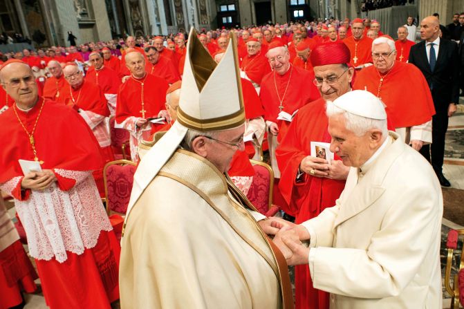 Pope Emeritus Benedict XVI, right, greets Pope Francis at St. Peter's Basilica in February 2015.