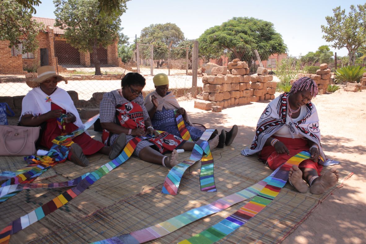 Ndebele beadworkers Sophie Masombuka, Magdalene Nkogatse, Phephelani Sikhosana and Wilhemina Aphane thread panels for the MiG-21 in Mpumalanga Province, South Africa. “Everything on that plane is 100% handmade,” said Ziman. “I can’t even begin to think about the hours that have gone into it.”