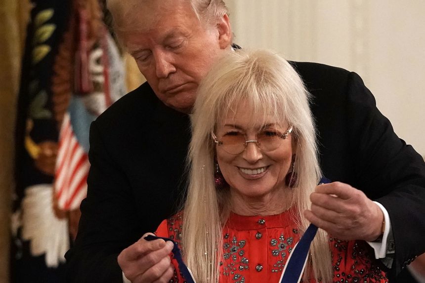 President Trump presents the Presidential Medal of Freedom to Miriam Adelson during a White House ceremony in 2018.