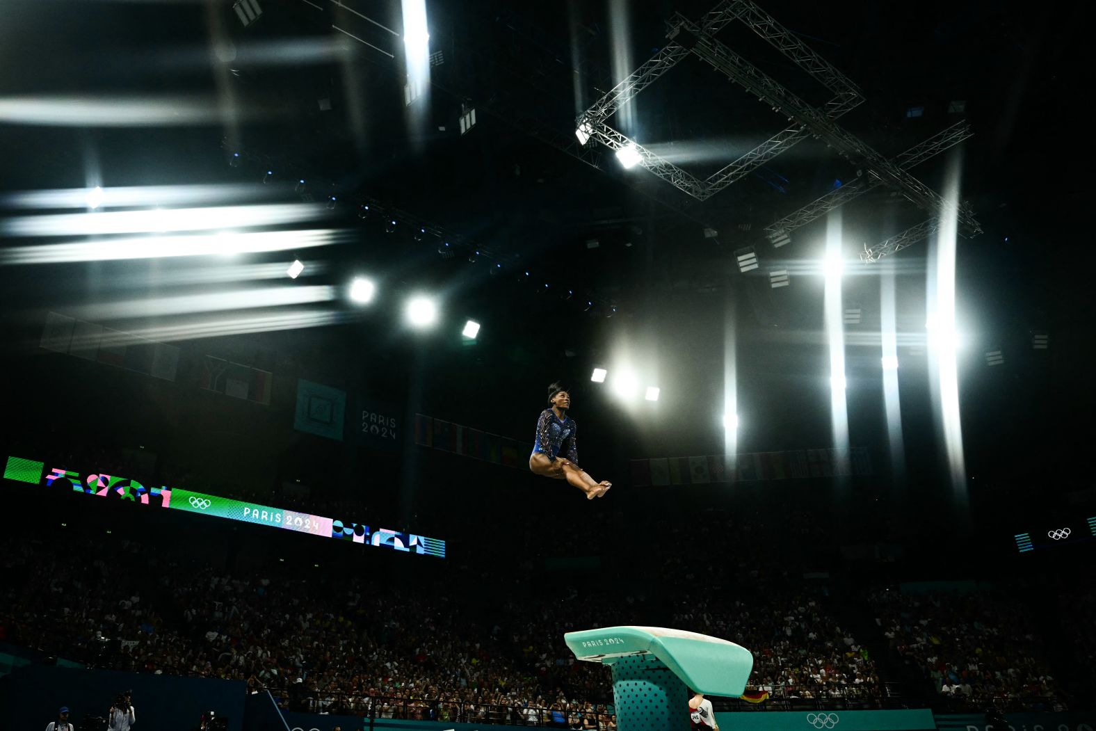 Biles completes her vault at the start of the competition. <a href="https://www.cnn.com/sport/live-news/paris-olympics-news-2024-08-01-24#h_bccfd5f094f566193cddae7fa3e71051">She performed a Yurchenko double pike</a> that is also known as the Biles II. It is one of her five signature moves.