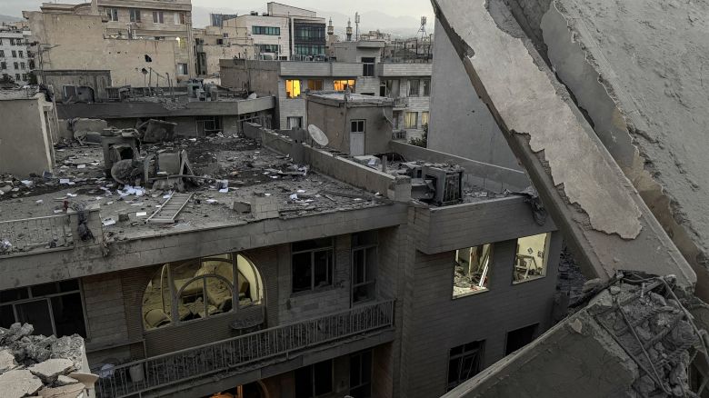 Debris and rubble are pictured at the scene of a building that was hit by an Israeli strike in Tehran on June 13, 2025. Israel hit about 100 targets in Iran on June 13, including nuclear facilities and military command centres and killing senior figures including the armed forces chief and top nuclear scientists. (Photo by MEGHDAD MADADI / TASNIM NEWS / AFP) (Photo by MEGHDAD MADADI/TASNIM NEWS/AFP via Getty Images)          