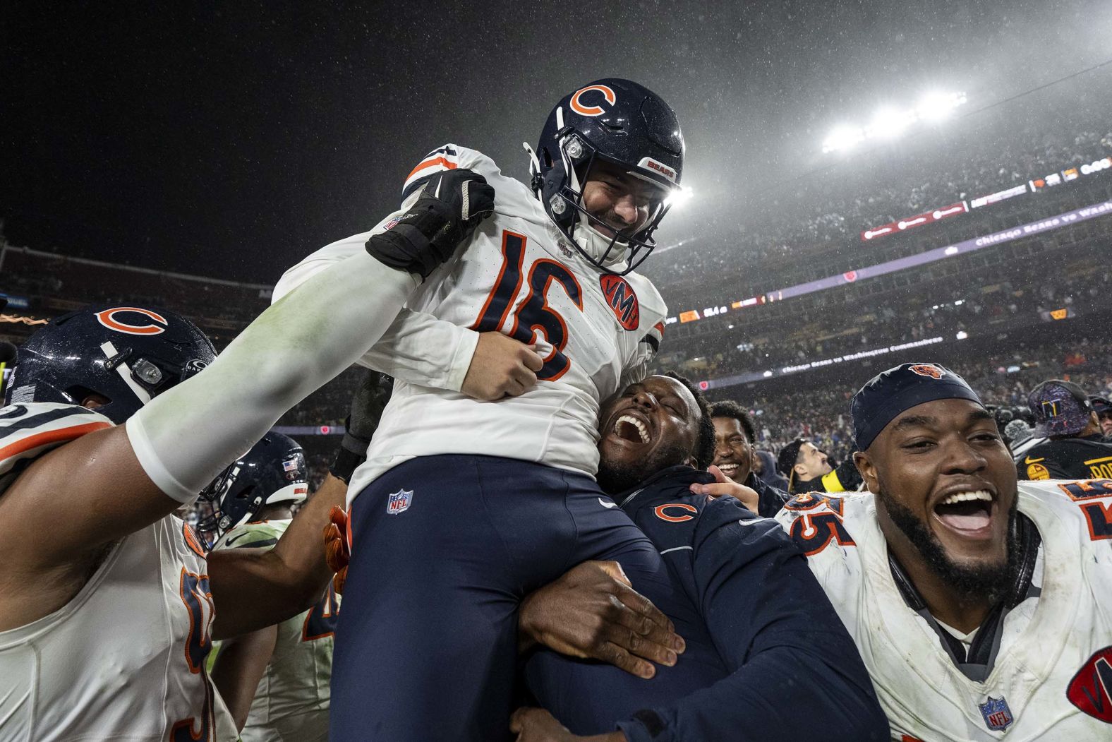 Chicago Bears kicker Jake Moody is held up by his teammates after hitting the game-winning field goal during an NFL game against the Washington Commanders on Monday, October 13.