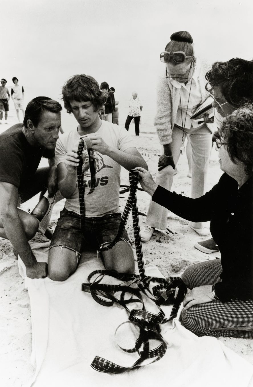 Scheider, left, and Spielberg examine footage from the day's production. Spielberg <a href="index.php?page=&url=https%3A%2F%2Fwww.vanityfair.com%2Fhollywood%2F2023%2F07%2Fjaws-making-of-spielberg-interview%3Fsrsltid%3DAfmBOopI6ZP8fWZrTbENkPtgy50NJ3sit5uLz_0OMgGyNAe6gdVd9SQw" target="_blank">said</a> he cast Scheider after running into the actor at a party, and Scheider recommended himself for the part.