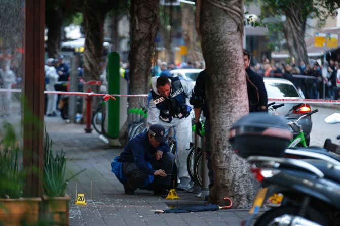 Forensic experts inspect the scene.