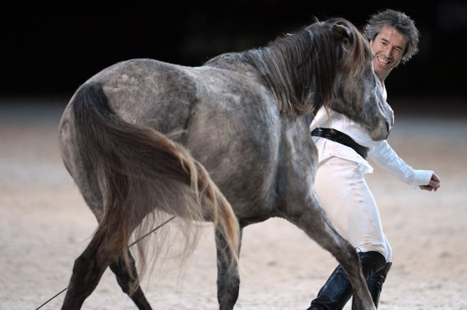 Pignon has taken his show all over the world, performing in Europe, the Middle East, the Far East and Africa. Here he is performing with his horses at the opening ceremony for the 2014 FEI World Cup jumping and dressage finals in Chassieu, France.