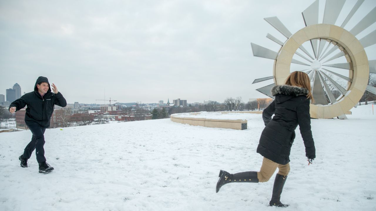 U.S. Sen. Marco Rubio, a Republican presidential candidate, playfully throws a snowball at his wife, Jeanette, as they take their two boys sledding in Des Moines, Iowa, on Wednesday, December 30.