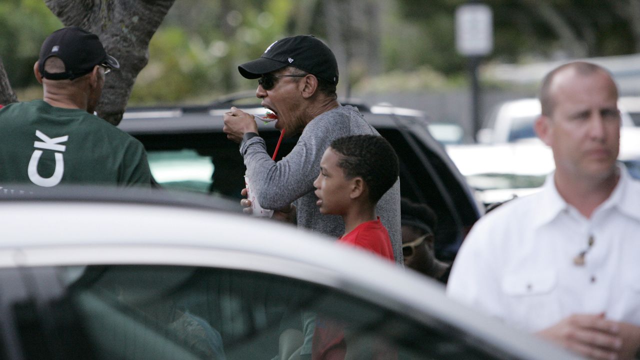 President Barack Obama eats shaved ice during his holiday vacation in Kailua, Hawaii, on Sunday, December 27.