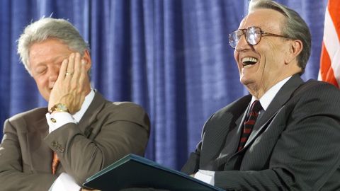 President Bill Clinton laughs with former U.S. Sen. Dale Bumpers, D-Arkansas, during the National Institutes of Health dedication ceremony of the Dale and Betty Bumpers Vaccine Research Center on June 9, 1999, in Bethesda, Maryland.