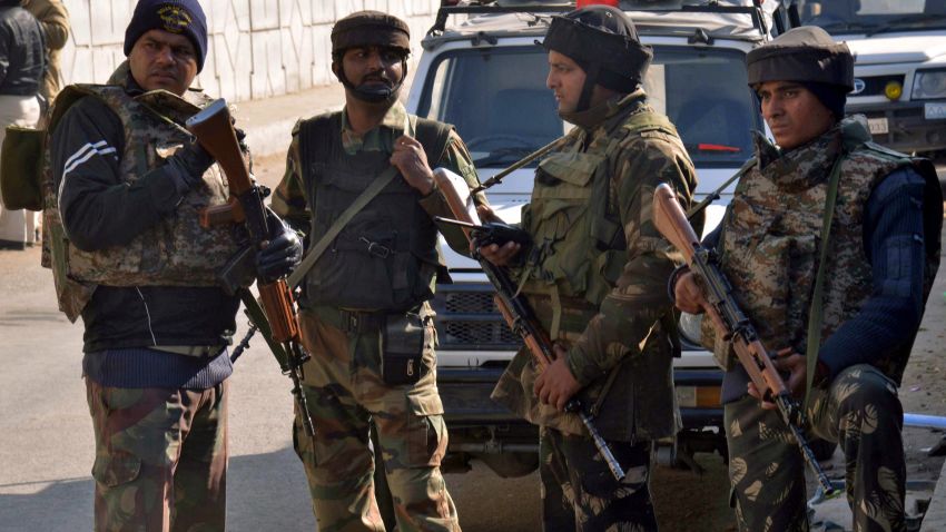 Indian security personnel stand alert on a road leading to an airforce base in Pathankot on January 2, 2016, during an ongoing attack on the base in the northern Indian state of Punjab by suspected militants.  Suspected Islamist gunmen have staged a pre-dawn attack on a key Indian air base near the Pakistan border with two militants killed in a shootout, officials said, striking a blow to the neighbours' fragile peace process. AFP PHOTO/NARINDER NANU / AFP / NARINDER NANU        (Photo credit should read NARINDER NANU/AFP/Getty Images)