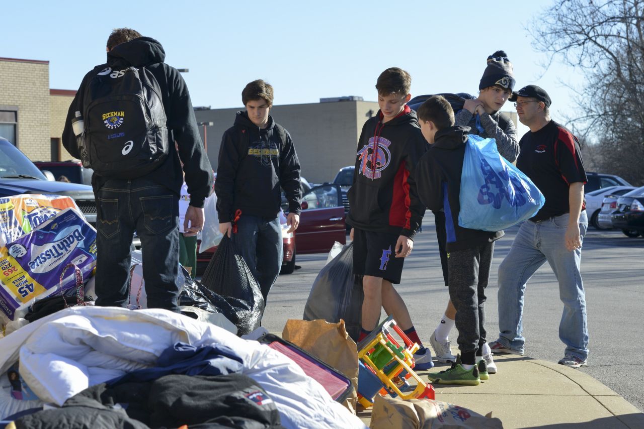 Volunteers collect donations for flood victims at Fox High School in Arnold, Missouri, on Saturday, January 2.