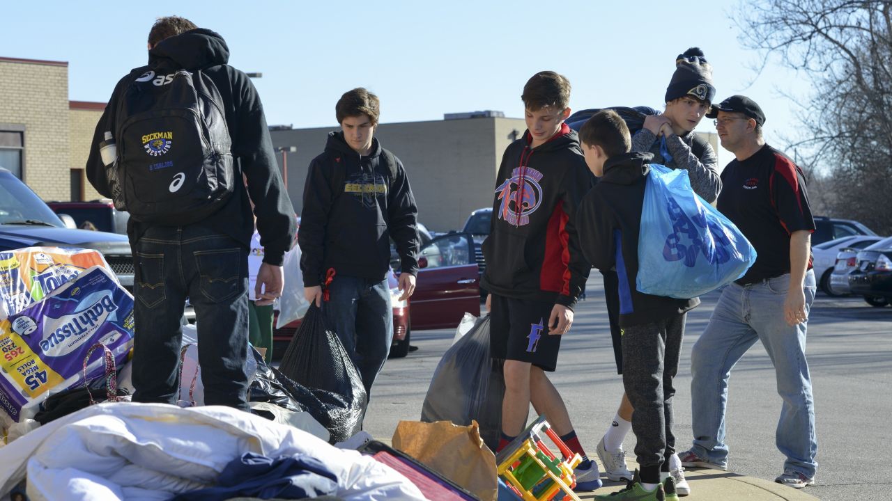 Donations are collected by students and volunteers at Fox High School in Arnold, Missouri on January 2, 2016, for flood victims. Missouri and Illinois have been hard hit by the record-breaking and relentless deluge, with many river levels in the area at all-time highs. The death toll from the flooding in the Midwest is now at 23, CNN said. Fifteen of the dead were in Missouri and eight in Illinois. Swaths of the United States have been buffeted over the holiday season by tornadoes, storms and torrential rain, while the US East Coast has seen unseasonably warm weather. AFP PHOTO/KATE MUNSCHKate Munsch/AFP/Getty Image