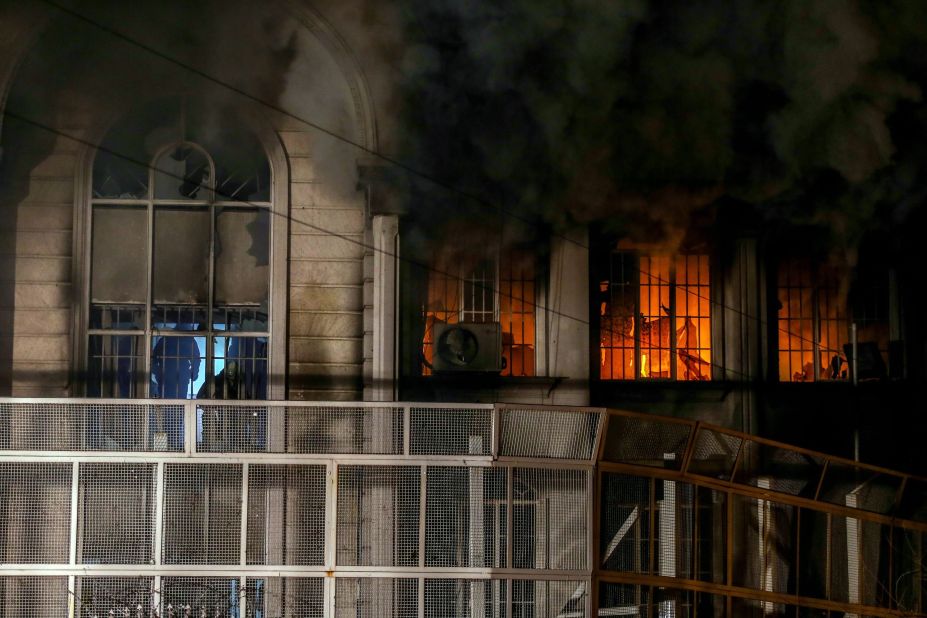 Smoke billows from the windows of the burning Saudi Embassy on January 2. A CNN producer in Tehran said some protesters made it inside the building, setting fire and ransacking some records.