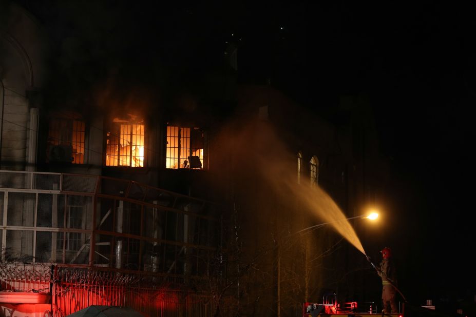 A firefighter sprays water on the flames on January 2 in Tehran, Iran, a Shiite-majority nation, issued a statement deploring the execution and warning that Saudi Arabia would pay a heavy price for its policies.