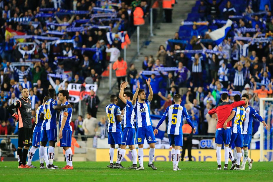 Espanyol players salute the club's fans at the final whistle.