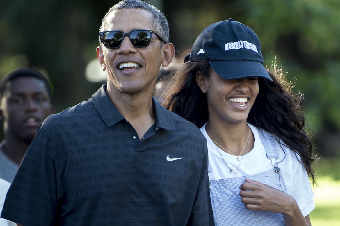 Obama and his daughter Malia walk during a visit to the Honolulu Zoo on January 2.