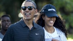 President Barack Obama and his daughter Malia Obama walk during a visit to the Honolulu Zoo on January 2, 2016, in Honolulu.