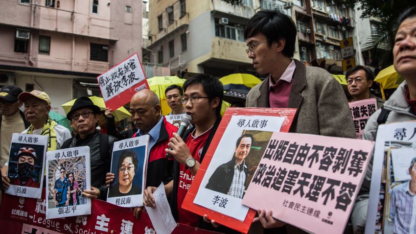 Protestors hold up missing person notices of (L-R) Mighty Current publisher of books critical of China company's general manager Lui Bo and colleagues Cheung Jiping, Gui Minhai, Lee Bo and Lam Wing-kei as they walk towards China's Liaison Office in Hong Kong on January 3, 2016. Five missing Hong Kong booksellers were rumoured to have been planning a book about Chinese President Xi Jinping's relationship with a former girlfriend, one of the city's lawmakers said on January 3, as protesters gathered to voice anger over the case.  AFP PHOTO / ANTHONY WALLACE / AFP / ANTHONY WALLACE        (Photo credit should read ANTHONY WALLACE/AFP/Getty Images)