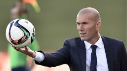 Former French football star and coach of Real Madrid Castilla Zinedine Zidane catches a ball during the Spanish league second division football match Real Madrid Castilla vsTalavera de la Reina at the Alfredo di Stefano Stadium in Valdebebas on the outskirts of Madrid on December 19, 2015.  AFP PHOTO / GERARD JULIEN / AFP / GERARD JULIEN        (Photo credit should read GERARD JULIEN/AFP/Getty Images)