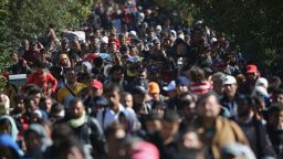 HEGYESHALOM, HUNGARY - SEPTEMBER 22:  Hundreds of migrants who arrived on the second train today at Hegyeshalom on the Hungarian and Austrian border, walk the four kilometres into Austria on September 22, 2015 in Hegyeshalom, Hungary. Thousands of migrants have arrived in Austria over the weekend with more en-route from Hungary, Croatia and Slovenia. Politicians across the European Union are holding meetings on the refugee crisis with EU leaders attending an extraordinary summit on September 23 to try and solve the crisis and the dispute of how to relocate 120,000 migrants across EU states.  (Photo by Christopher Furlong/Getty Images)